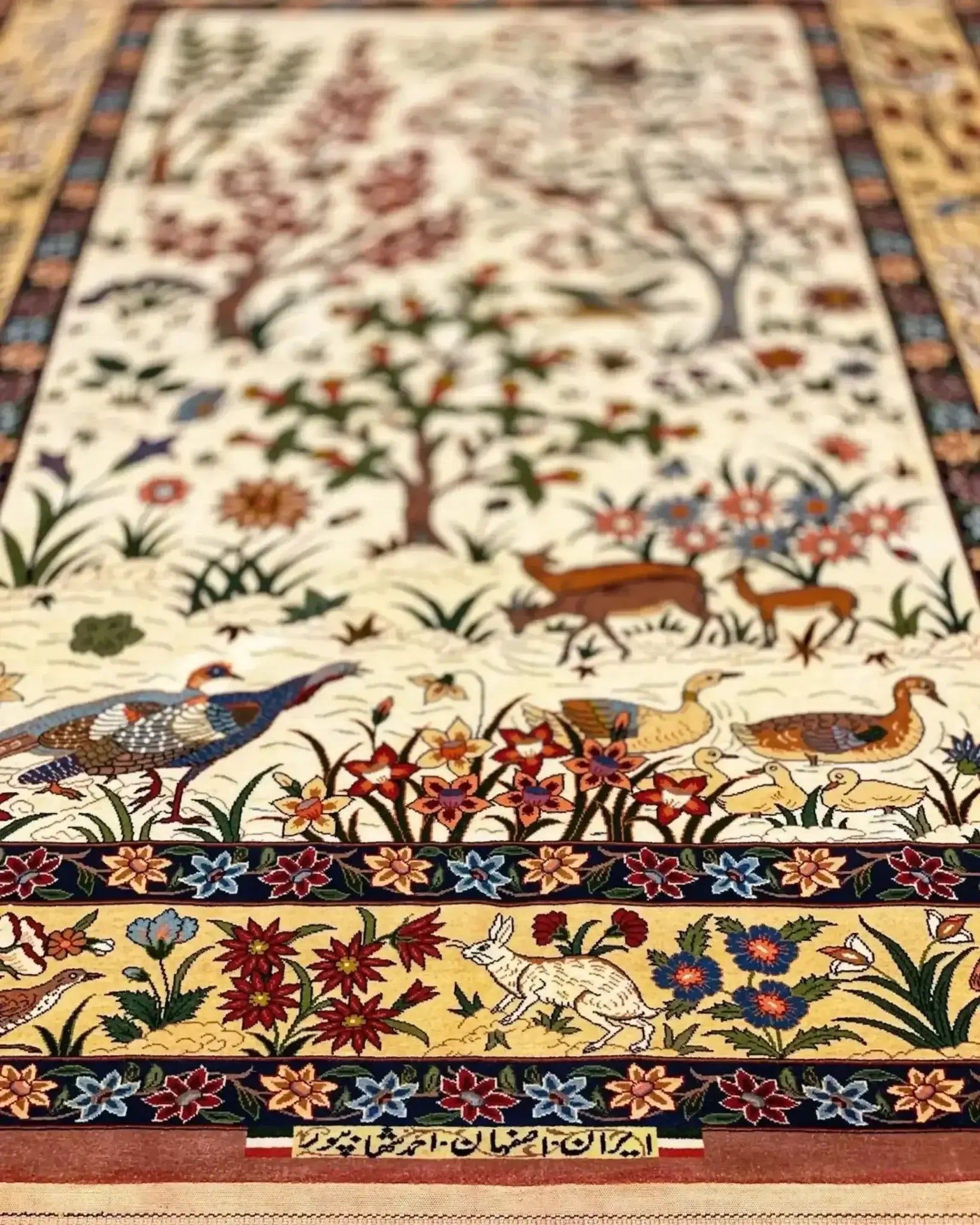 "Luxury Persian rug crafted by Ahmad Shahabpour, featuring detailed bird and floral motifs, 5 x 3.3 feet."